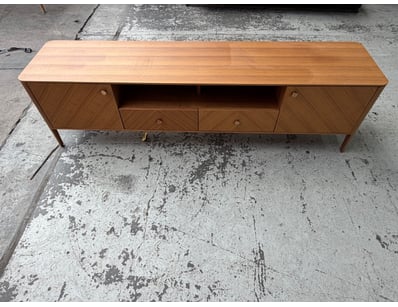 Mid-century modern teak sideboard featuring a clea...