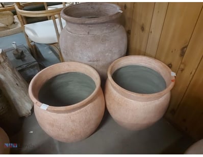 Collection of three terracotta storage vessels in ...