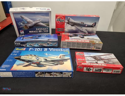 COLLECTION OF SEVEN UNASSEMBLED AIRCRAFT MODEL KIT...
