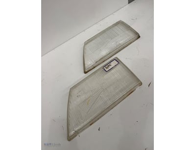 Pair of vintage automotive headlight lenses with r...