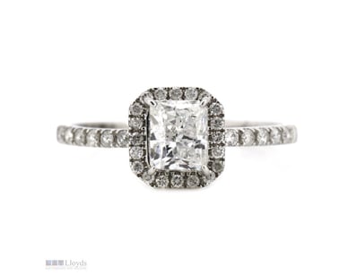 14K WHITE GOLD AND DIAMOND, HALO RING.      

The ...