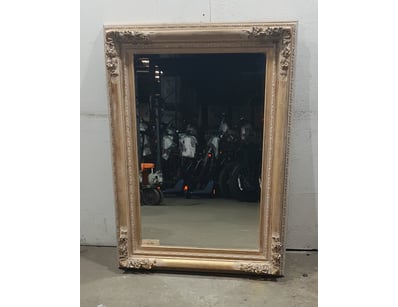Ornate decorative mirror featuring an elaborate wo...
