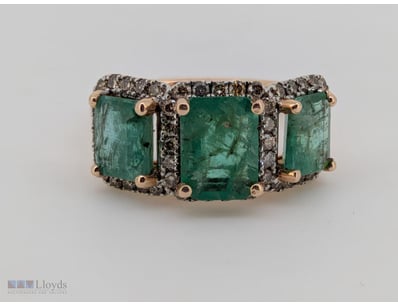 9CT ROSE GOLD COLOMBIAN EMERALD AND DIAMOND RING

...