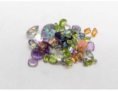 129.9 TCW MIXED GEMSTONES

Includes Azotic Topaz, ...