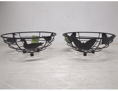 Various decorative black metal wire baskets featur...
