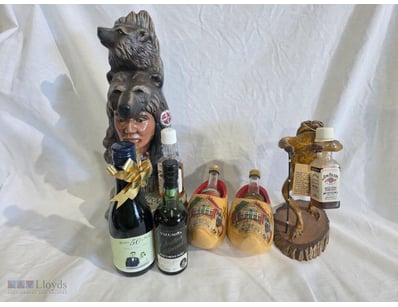 Curated collection of decorative spirit bottle hol...