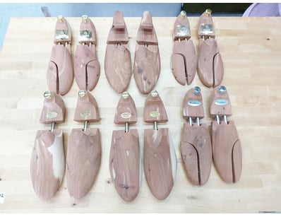 Collection of x6 pairs of wooden shoe trees in nat...