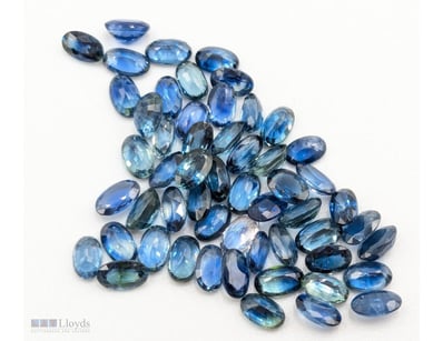 FIFTY FIVE OVAL CUT NATURAL BLUE SAPPHIRES

Condit...