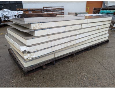 Stack of composite insulated panels featuring poly...