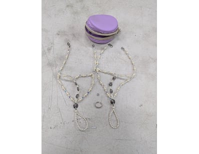 Necklaces with white and clear beads and ring in p...