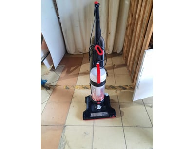 Corded vacuum cleaner, black and red  finish.

