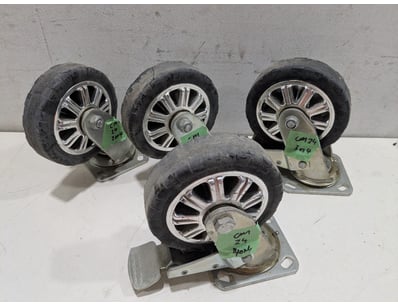 Set of four industrial-grade swivel casters featur...