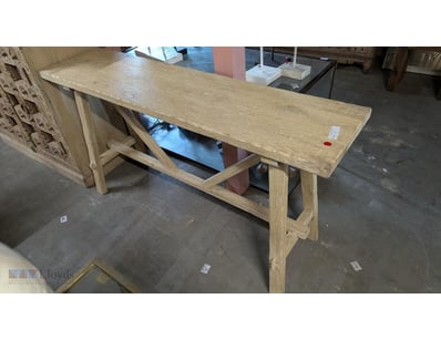 Timber hall table featuring a light natural finish...