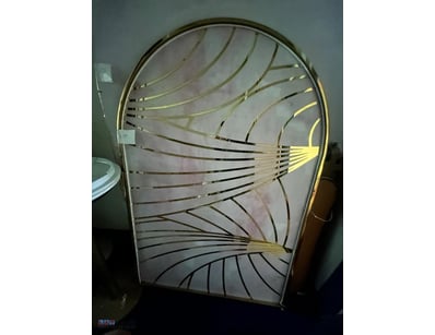 Elegant arched wall mirror featuring a decorative ...