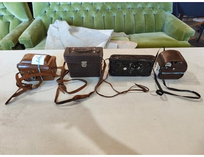 COLLECTION OF FOUR LEATHER CAMERA CASES

Item Si...