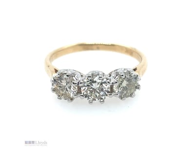 18CT YELLOW AND WHITE GOLD DIAMOND RING

Featuring...