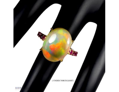 NATURAL RAINBOW FIRE OPAL & RUBY RING.      

Natu...