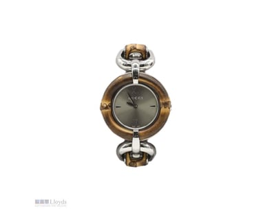 GUCCI CHAMPAGNE STAINLESS STEEL BAMBOO 132.4

Mate...