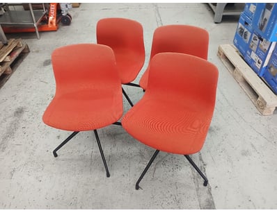 Set of four modern dining chairs featuring vibrant...