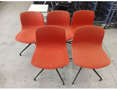 Set of five modern dining chairs featuring vibrant...