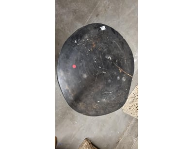 Black timber round coffee table featuring a solid ...
