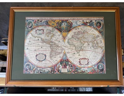 A framed antique world map titled "Nova Totius Ter...