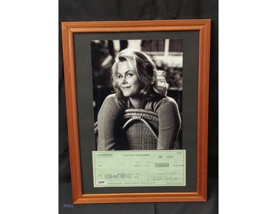 THIS FRAMED COLLECTIBLE FEATURES A BLACK AND WHITE...