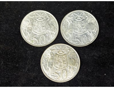 THREE SILVER 1966 ROUND FIFTY CENT COINS

Condit...