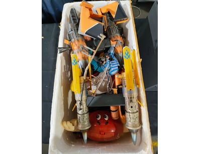 Vintage toy collection featuring transforming robo...