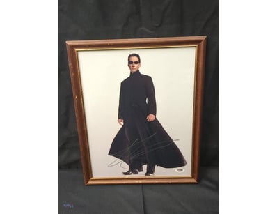 AUTOGRAPHED PHOTOGRAPH OF KEANU REEVES.

Item Size...
