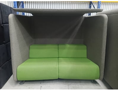 Modern high-backed armchair featuring a distinctiv...
