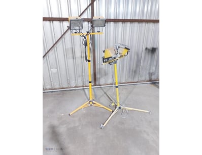 Adjustable flood lights mounted on tripod stands, ...