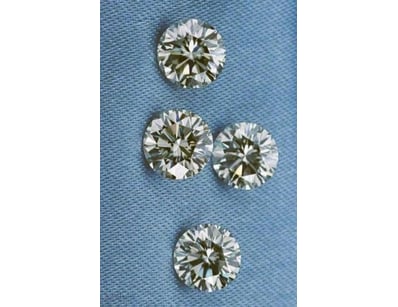 0.06 TCW BROWN 4 DIAMONDS        

Condition: Good...
