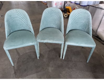 Set of three dining chairs featuring pale aqua uph...