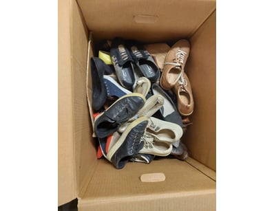 Large cardboard storage box containing a mixed col...