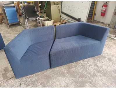 Modern modular two-piece sectional sofa in blue up...