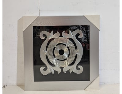 Contemporary decorative wall art piece featuring a...