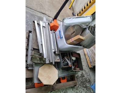 Assortment of kitchen equipment including wet saw ...