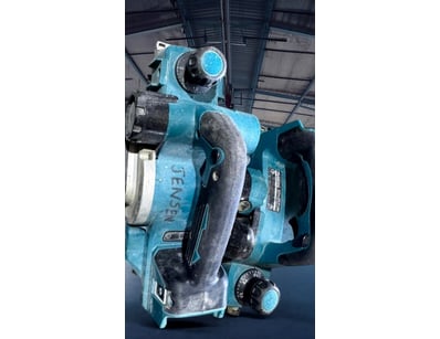 Makita bench-mounted wood planer, model appears to...