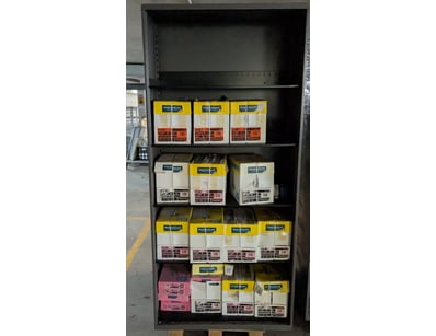 Industrial metal storage cabinet featuring five ad...