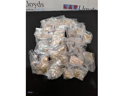 Lot of gold-toned pendant necklaces featuring resi...