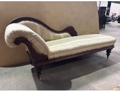 Elegant Victorian-era chaise lounge featuring a da...