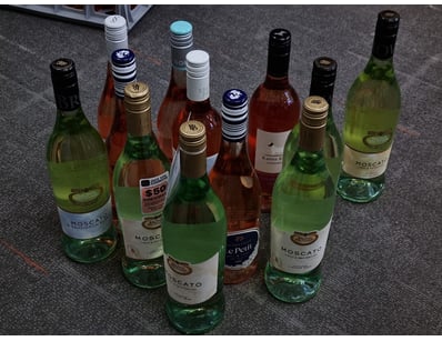 Curated collection of 12 wine bottles featuring pr...