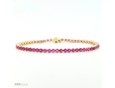 9CT YELLOW GOLD CEYLON RUBY LINE BRACELET      

F...