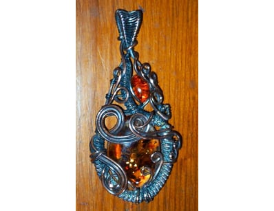 188 TCW WIRE WRAPPED AMBER PENDANT     

Fancy And...