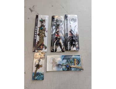 Collection of five licensed gaming merchandise key...