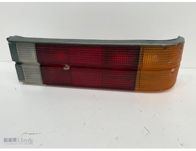 Vintage automotive tail light assembly featuring d...