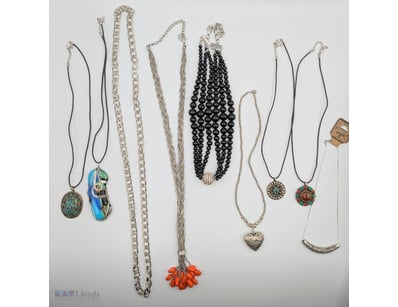 COLLECTION OF SILVER-TONED PENDANT NECKLACES WITH ...