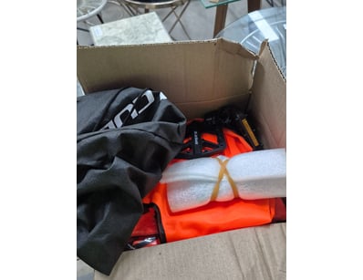 Box of assorted bike items inluding pair of pedals...