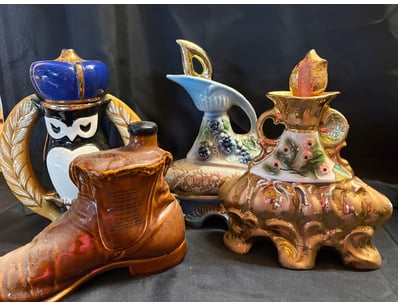 COLLECTION OF VINTAGE CERAMIC AND GLASS DECANTERS
...
